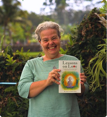 A reader holding Lessons on Love