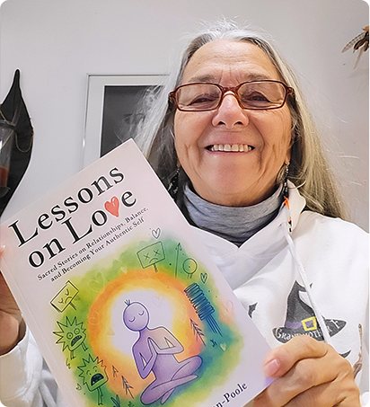 A reader holding Lessons on Love