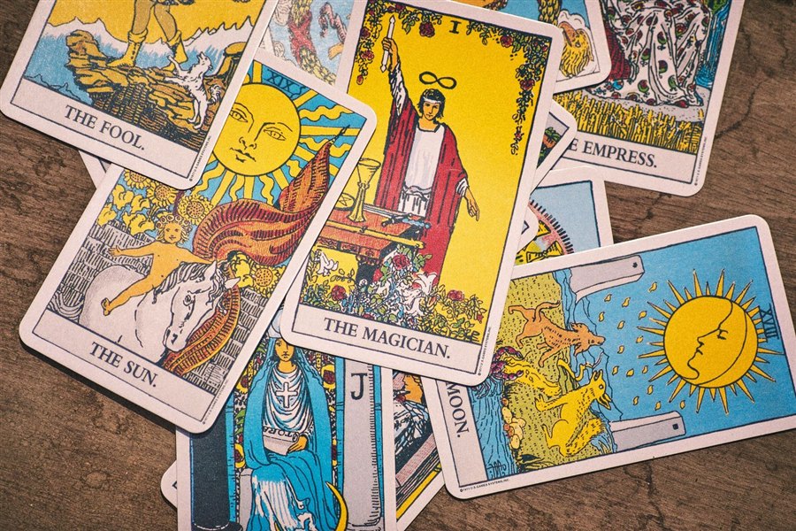 A spread of Rider-Waite tarot cards — The Fool, The Magician, The Sun, The Empress
